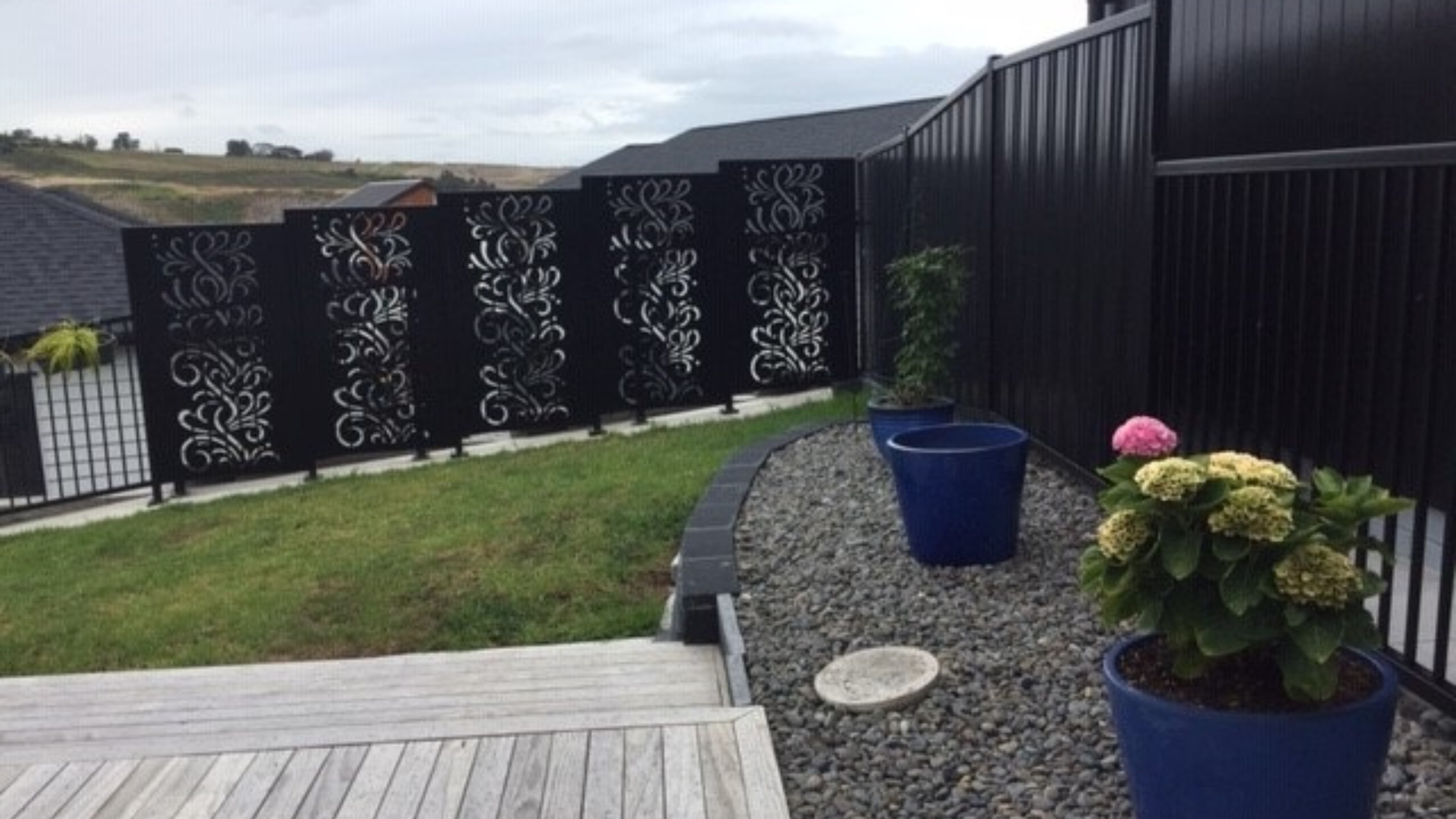 Steaming Decorative Metals Screens used in a fence application and a gate application